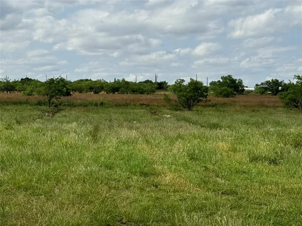 a view of lake with green space