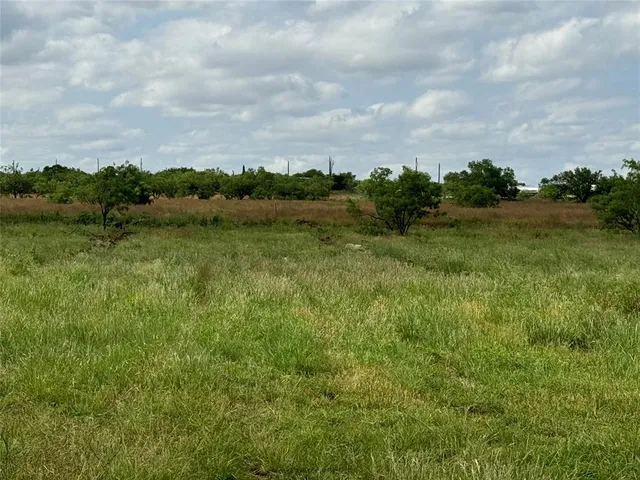 a view of lake with green space
