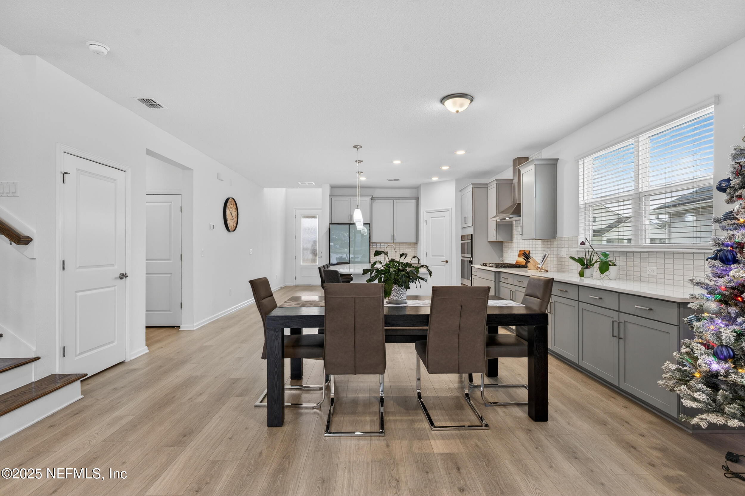 267 Twilight Lane St. Augustine, FL 32095 - Photo 19 of 50 a view of a dining room with furniture and wooden floor
