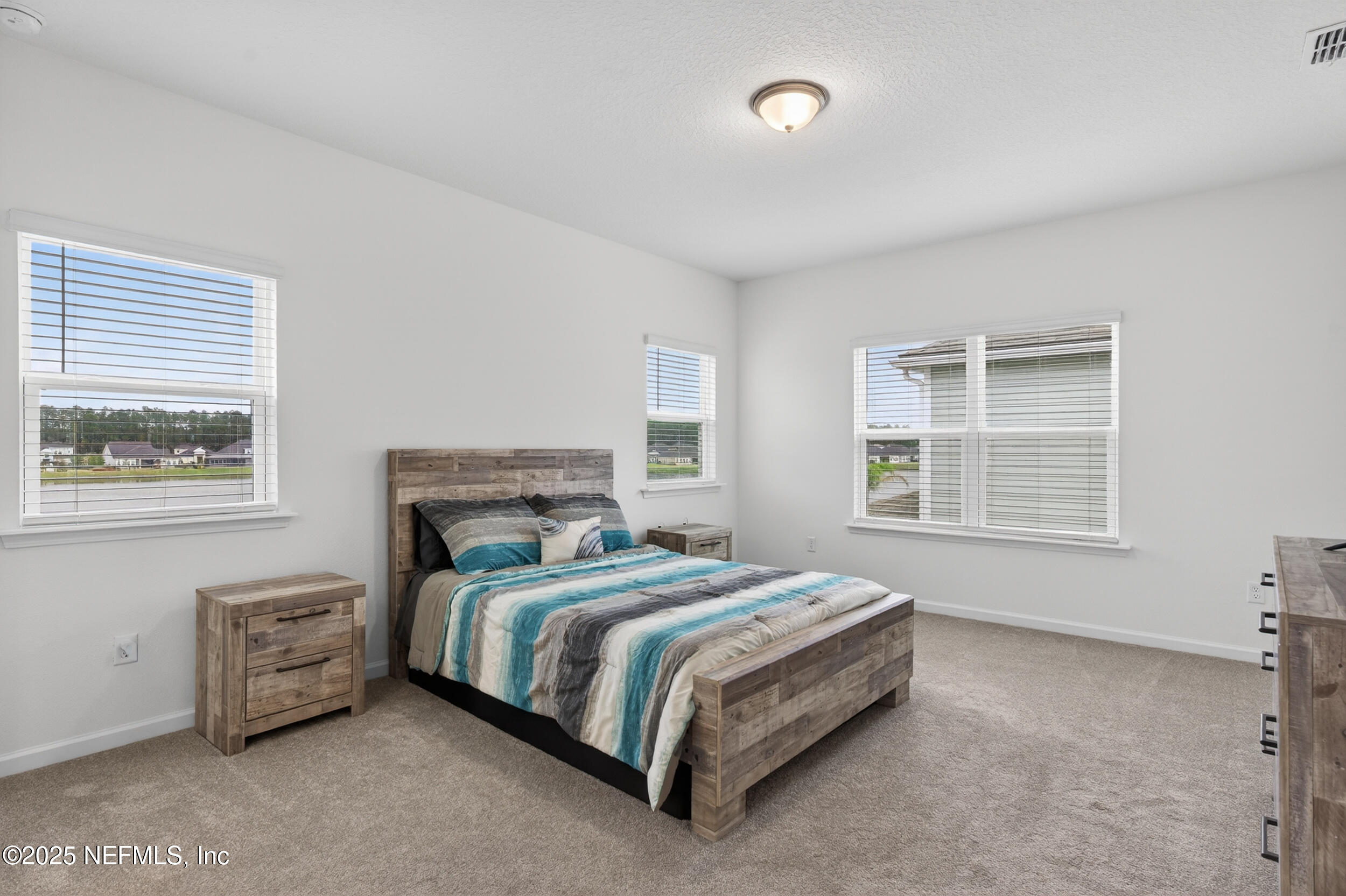 267 Twilight Lane St. Augustine, FL 32095 - Photo 20 of 50 a bedroom with a bed next to a window