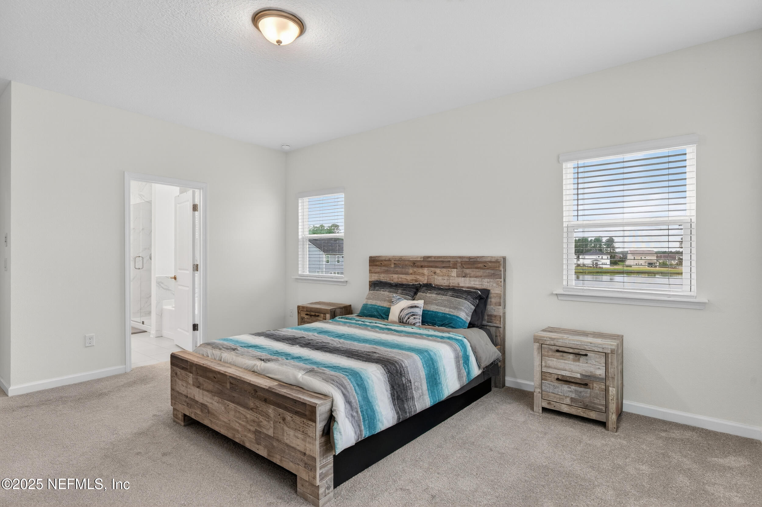 267 Twilight Lane St. Augustine, FL 32095 - Photo 22 of 50 a bedroom with a bed and a window