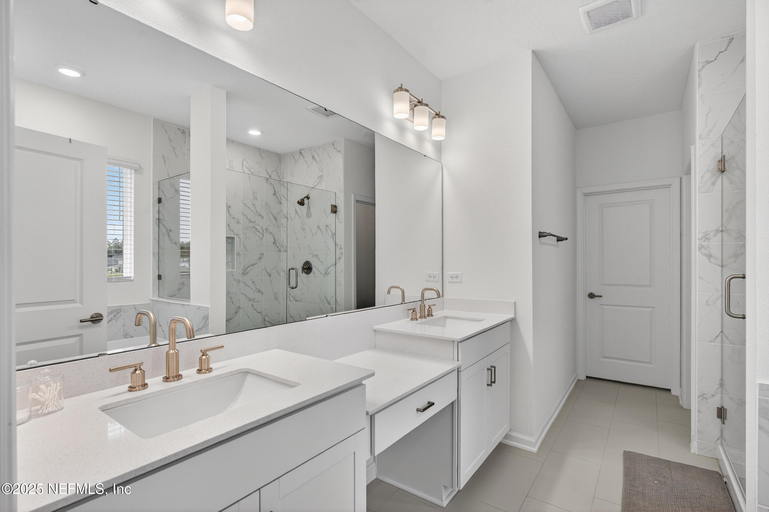 267 Twilight Lane St. Augustine, FL 32095 - Photo 24 of 50 a bathroom with a double vanity sink mirror and double