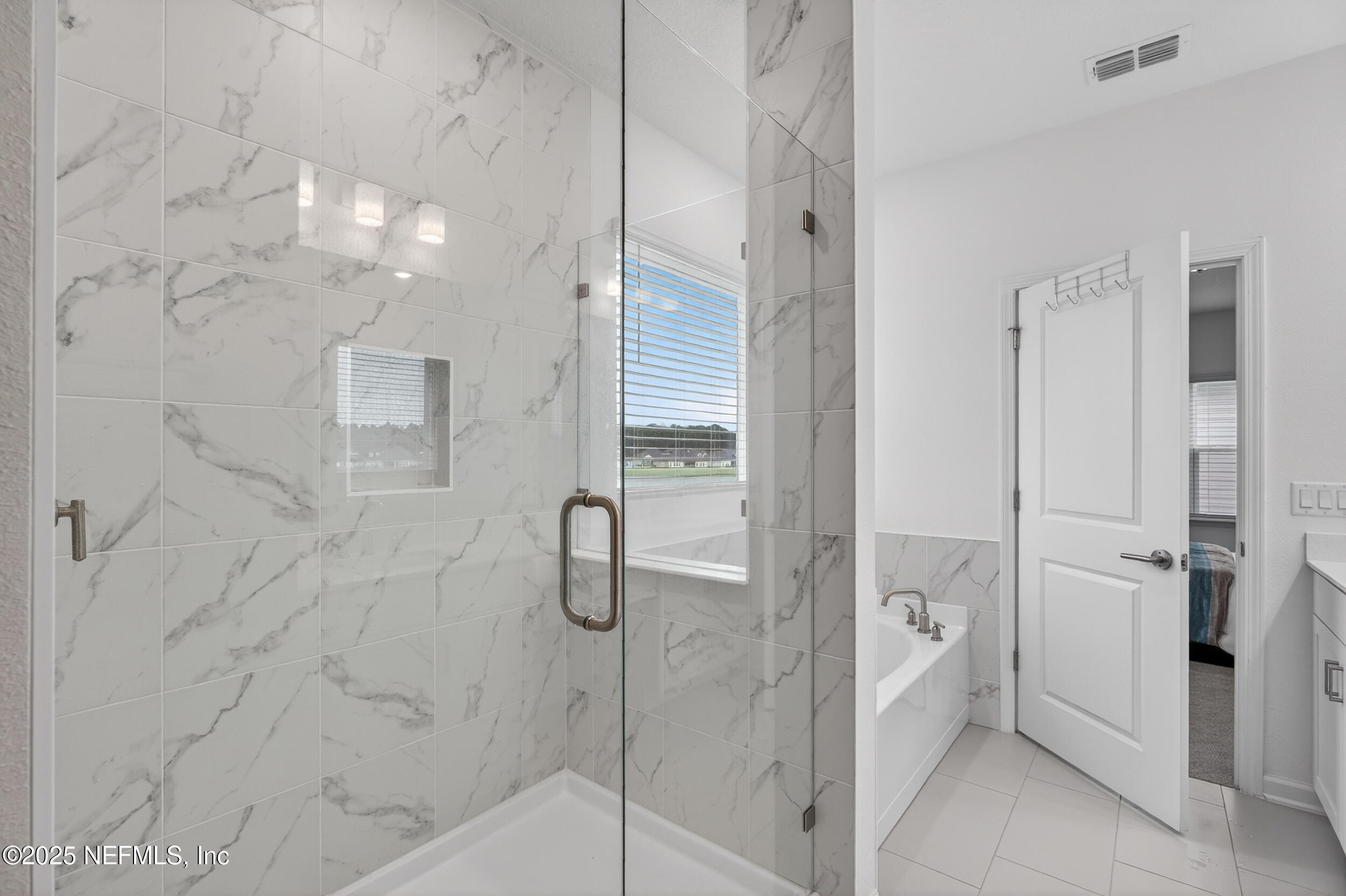 267 Twilight Lane St. Augustine, FL 32095 - Photo 26 of 50 a bathroom with a shower