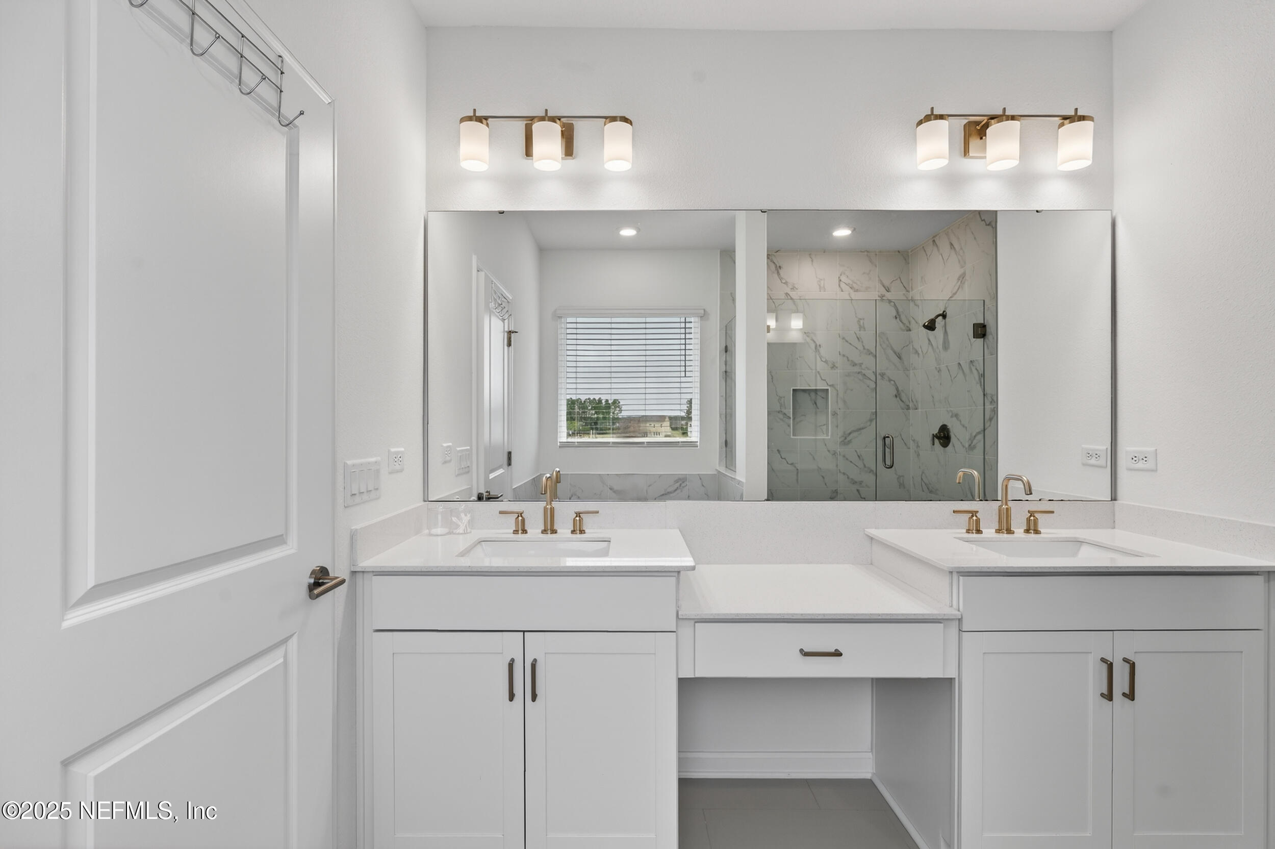 267 Twilight Lane St. Augustine, FL 32095 - Photo 28 of 50 a bathroom with a sink vanity and mirror