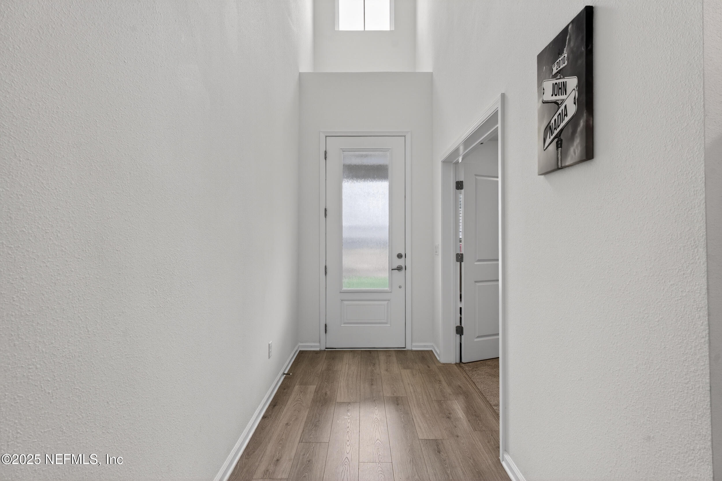 267 Twilight Lane St. Augustine, FL 32095 - Photo 3 of 50 a view of a hallway with wooden floor and closet