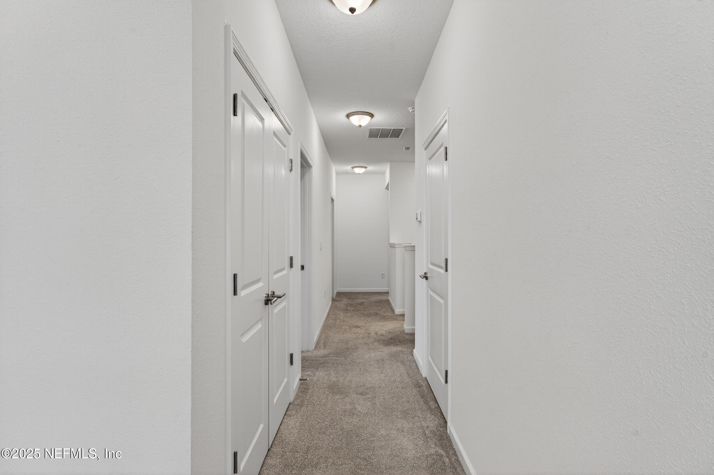 267 Twilight Lane St. Augustine, FL 32095 - Photo 32 of 50 a view of a hallway with wooden shelves