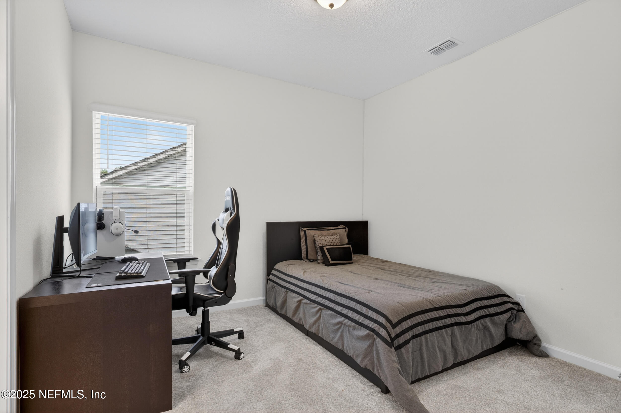 267 Twilight Lane St. Augustine, FL 32095 - Photo 37 of 50 a bedroom with a bed and a desk