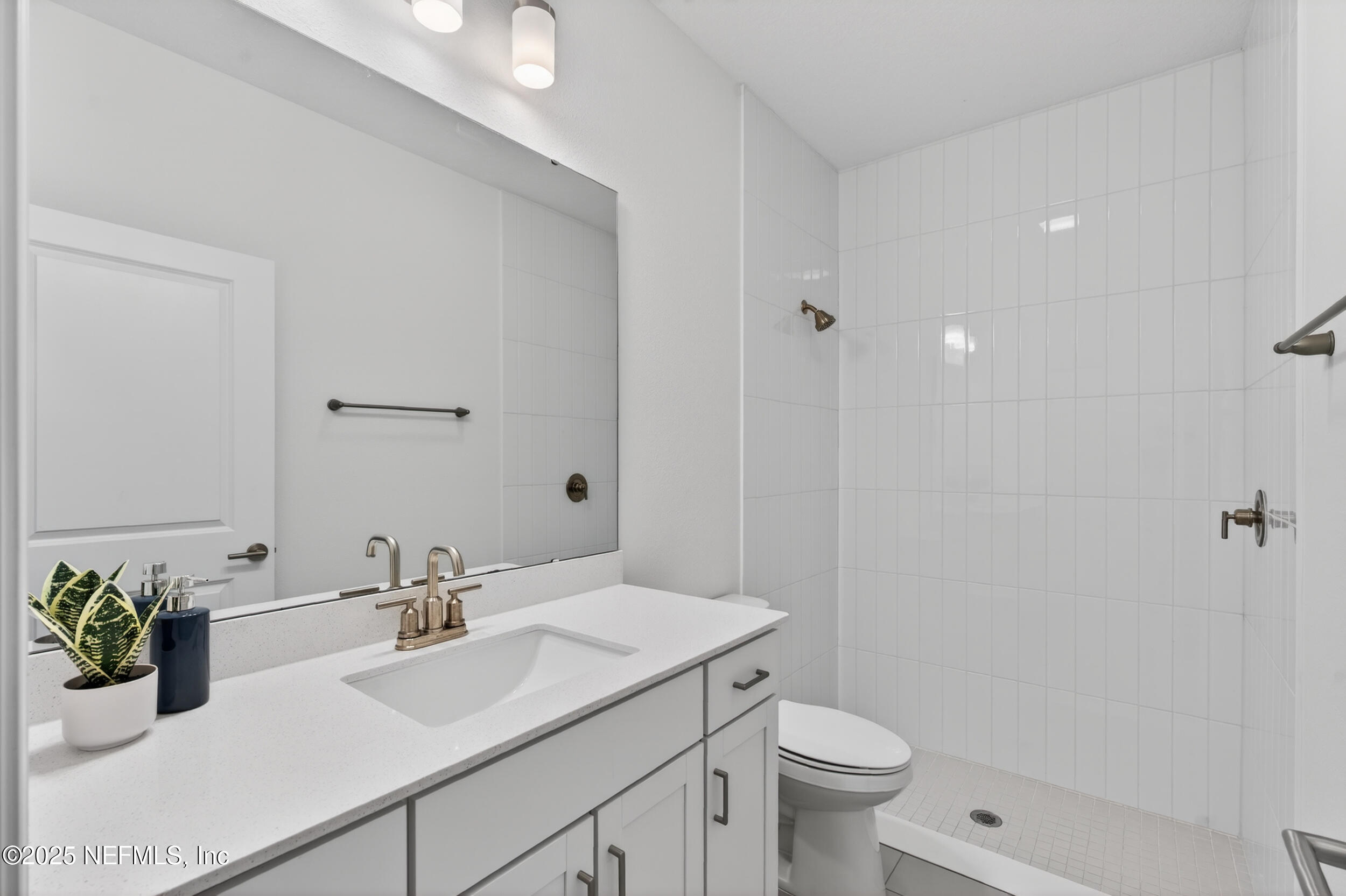 267 Twilight Lane St. Augustine, FL 32095 - Photo 39 of 50 a bathroom with a sink toilet and shower