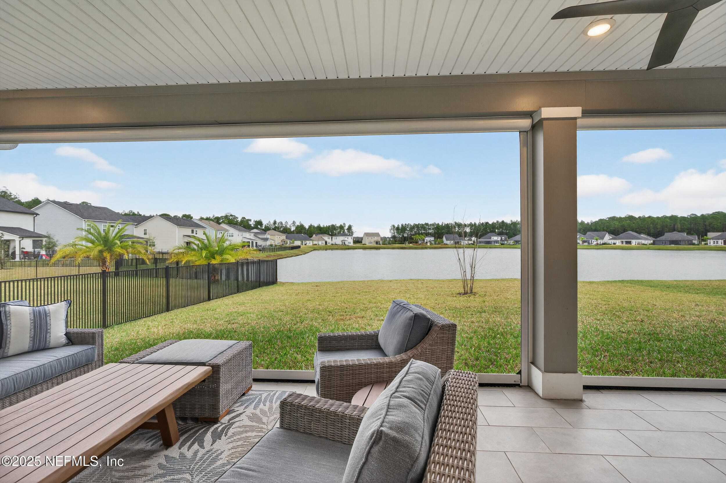 267 Twilight Lane St. Augustine, FL 32095 - Photo 42 of 50 a view of a patio with couches chairs and ocean view
