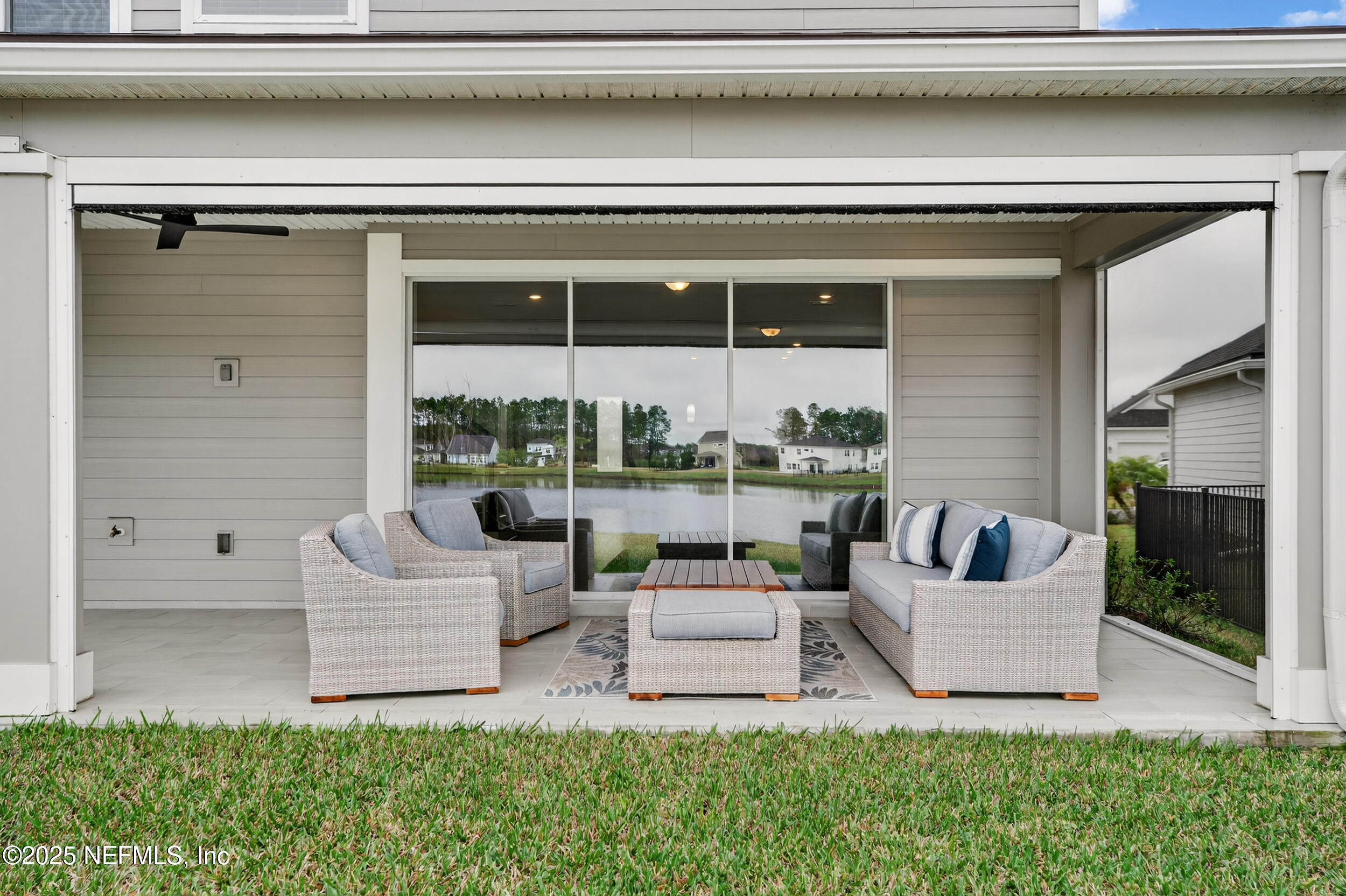 267 Twilight Lane St. Augustine, FL 32095 - Photo 50 of 50 a living room with couches and a potted plant