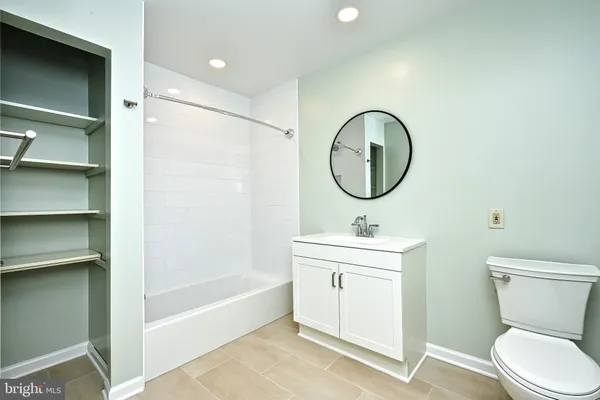 a bathroom with a toilet a sink and a bathtub