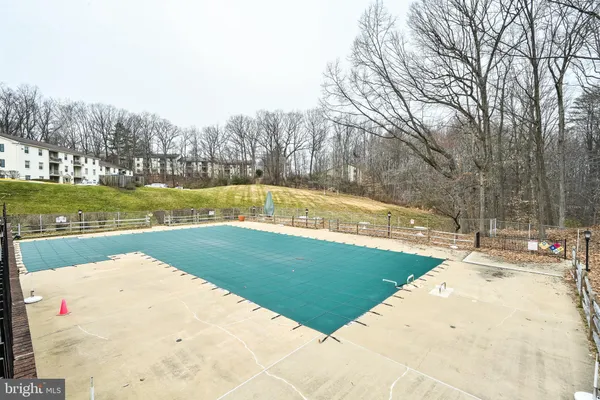 a view of a swimming pool with an outdoor space and seating area