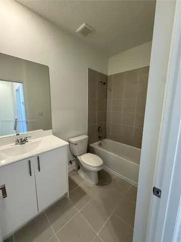 a view of a patio with swimming pool table and chairs
