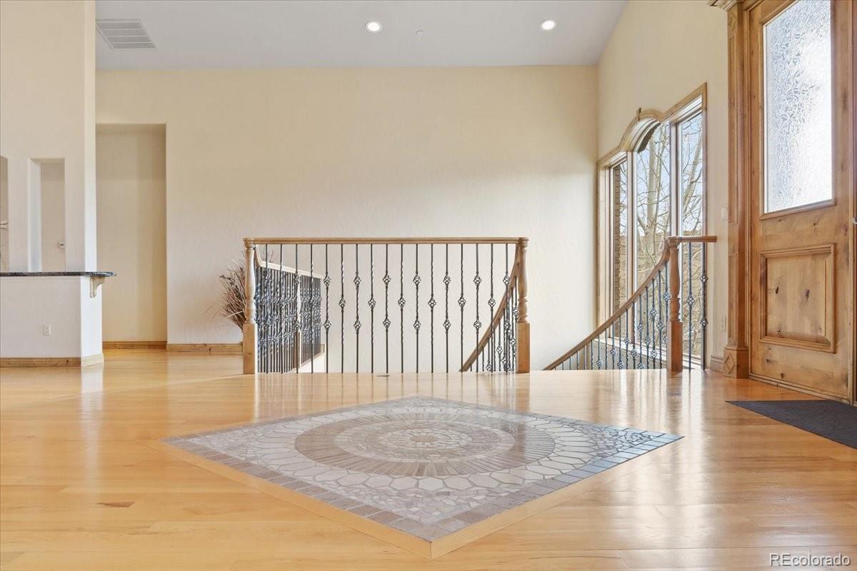 5881 Deer Meadow Trail Golden, CO 80403 - Photo 13 of 50 a view of entryway and hall with wooden floor