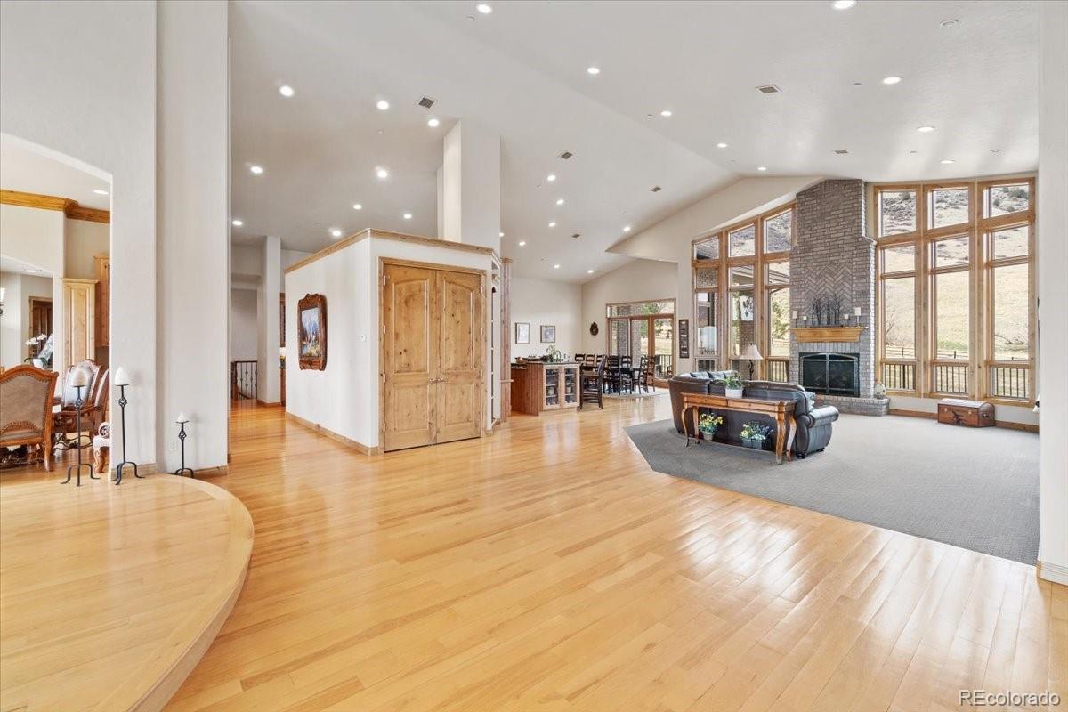 5881 Deer Meadow Trail Golden, CO 80403 - Photo 14 of 50 a view of a living room kitchen and a large window
