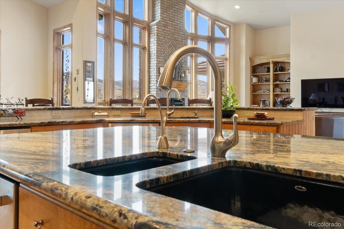 5881 Deer Meadow Trail Golden, CO 80403 - Photo 17 of 50 a kitchen with counter top space and living room