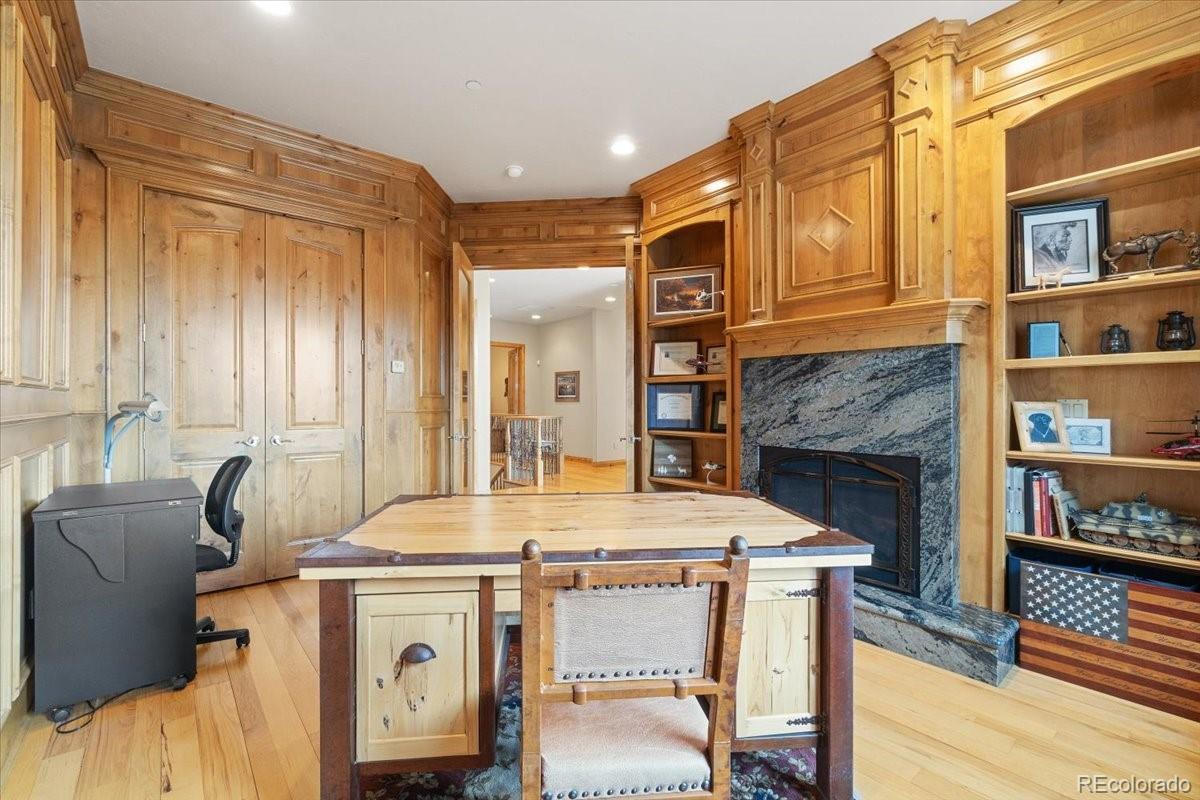 5881 Deer Meadow Trail Golden, CO 80403 - Photo 22 of 50 a dining room with fireplace furniture and a window