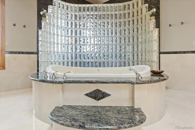 a living room with furniture a flat screen tv and a window