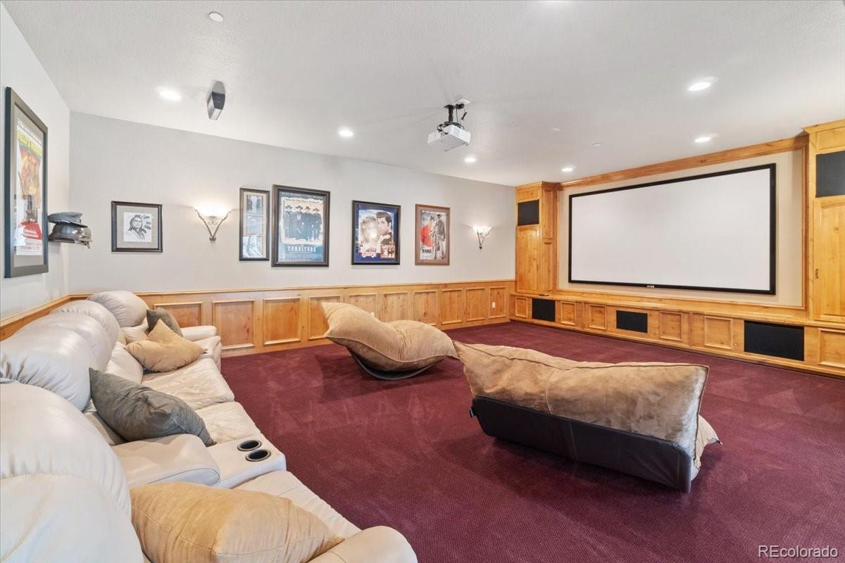 5881 Deer Meadow Trail Golden, CO 80403 - Photo 38 of 50 a spacious bedroom with a bed and a couch