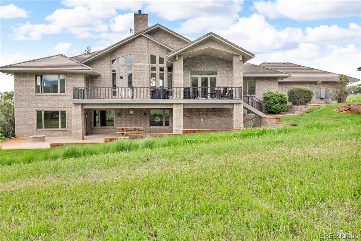 5881 Deer Meadow Trail Golden, CO 80403 - Photo 5 of 50 a front view of a house with a yard and potted plants