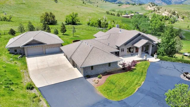a view of a backyard with sitting area