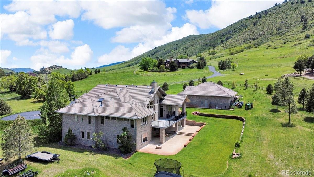 5881 Deer Meadow Trail Golden, CO 80403 - Photo 8 of 50 an aerial view of a house with swimming pool garden and patio