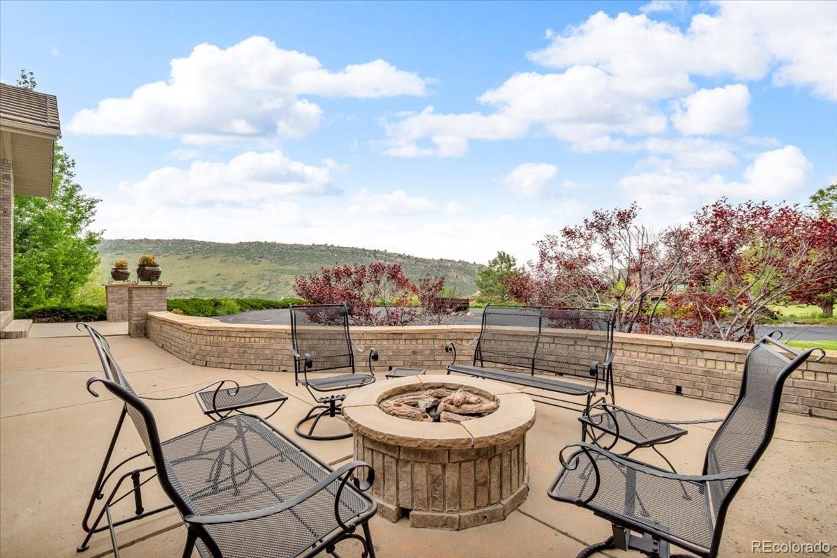 5881 Deer Meadow Trail Golden, CO 80403 - Photo 10 of 50 a view of a terrace with furniture and a table