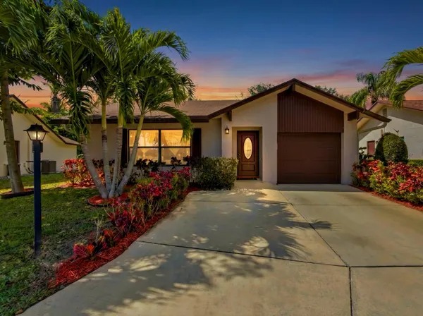 a front view of a house with a garage