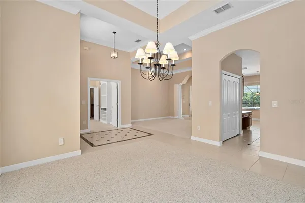 a kitchen with a sink window and cabinets