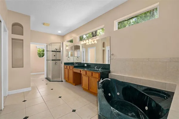a kitchen with a refrigerator and a sink
