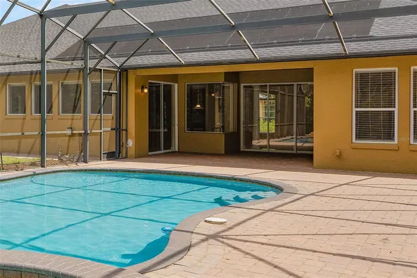 an aerial view of a house with outdoor space