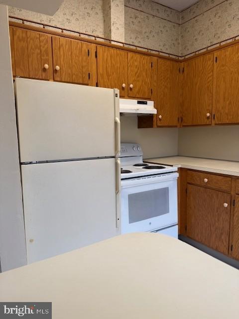 104 West Main Street, Unit 33 Waynesboro, PA 17268 - Photo 6 of 8 a kitchen with a refrigerator and a stove