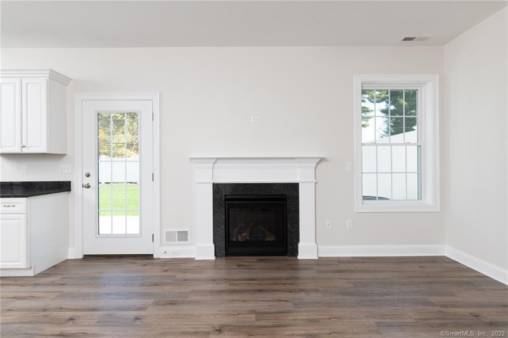 29 Covey Road, Unit 13 Burlington, CT 06013 - Photo 11 of 34 a view of an empty room with wooden floor and a window