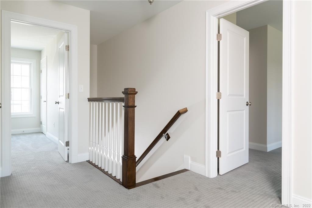29 Covey Road, Unit 13 Burlington, CT 06013 - Photo 19 of 34 a view of a hallway with white walls
