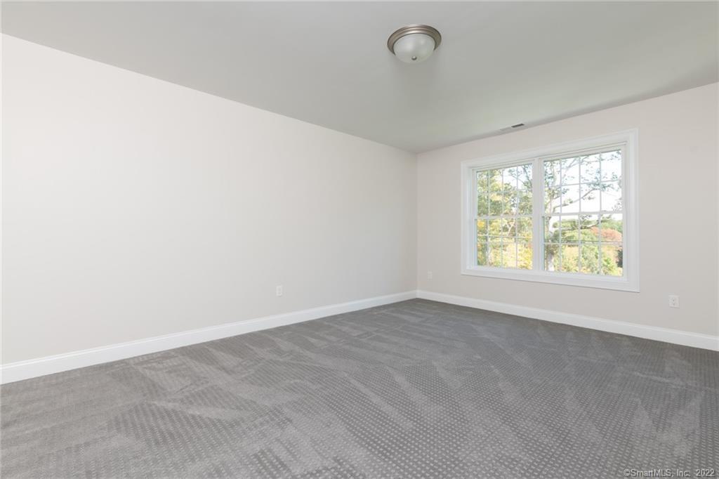 29 Covey Road, Unit 13 Burlington, CT 06013 - Photo 25 of 34 an empty room with windows