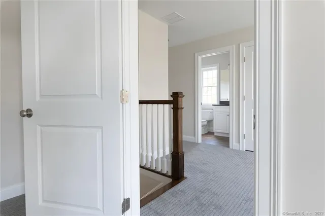 a view of a bathroom from a hallway