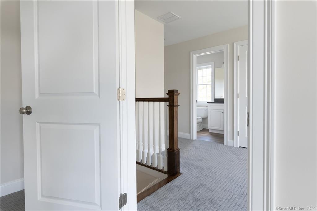29 Covey Road, Unit 13 Burlington, CT 06013 - Photo 30 of 34 a view of a bathroom from a hallway