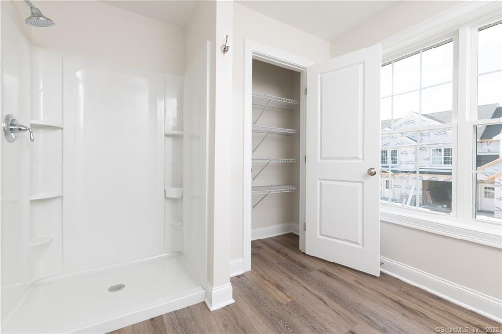 29 Covey Road, Unit 13 Burlington, CT 06013 - Photo 34 of 34 a view of a bathroom with a tub and window