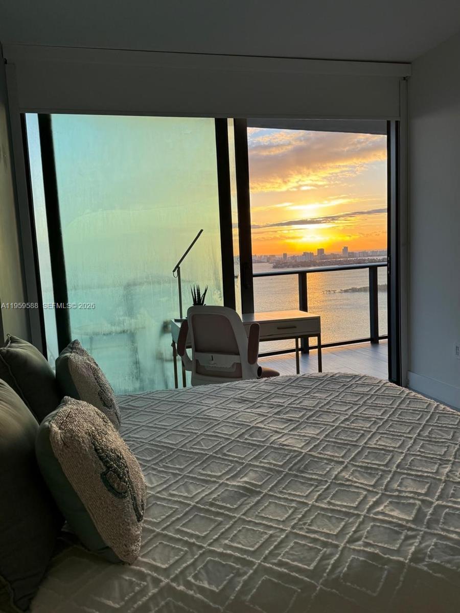 460 Northeast 28th Street, Unit 3307 Miami, FL 33137 - Photo 8 of 13 a living room with furniture and a large window