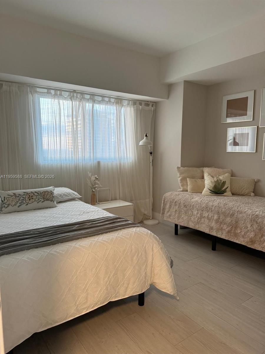 460 Northeast 28th Street, Unit 3307 Miami, FL 33137 - Photo 10 of 13 a bedroom with a bed and a window