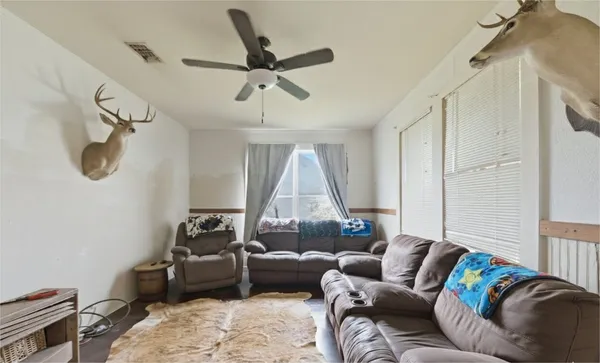 a dining room with furniture and window
