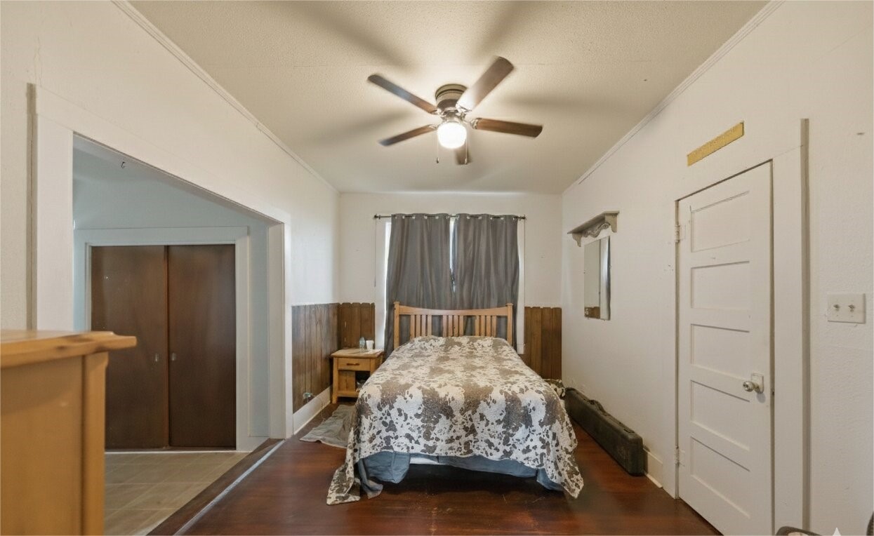 17714 Day Road Needville, TX 77461 - Photo 15 of 22 a bedroom with a bed and a chandelier