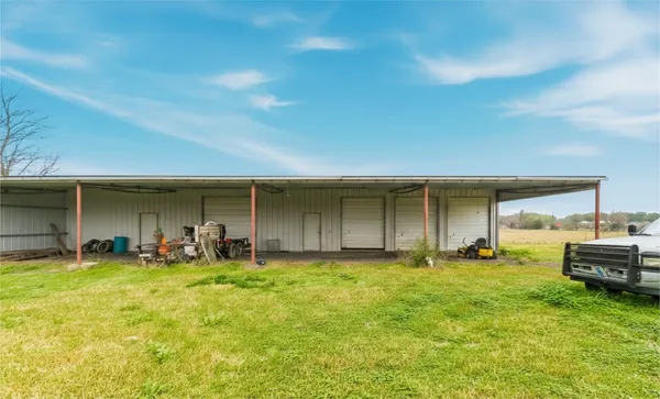a view of back yard with swimming pool