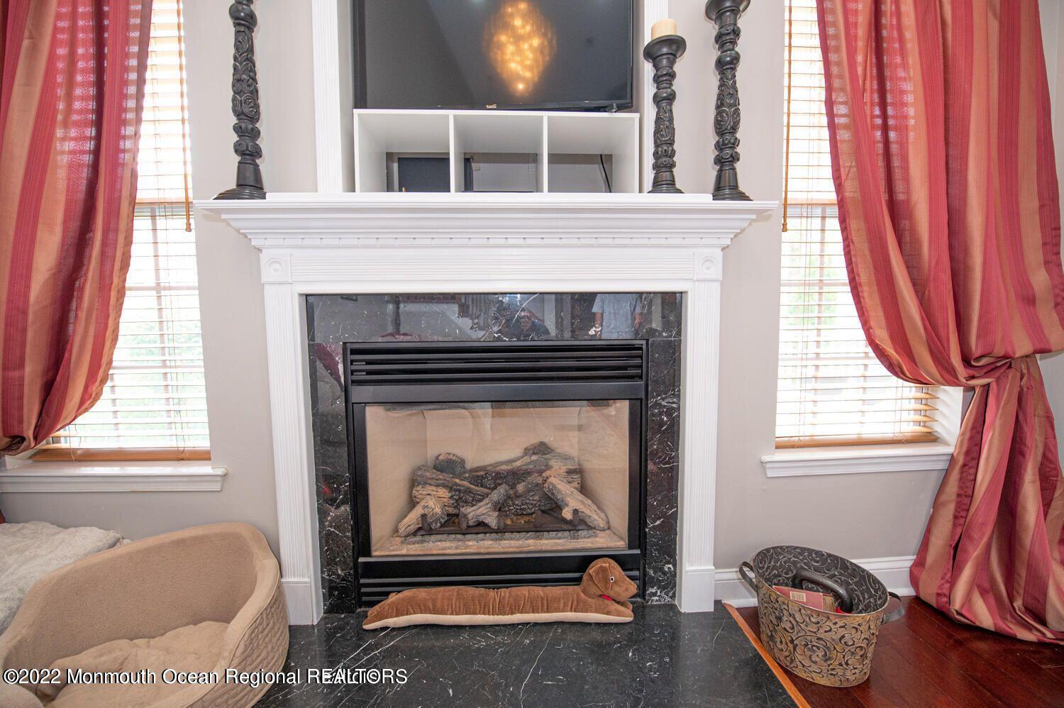 109 Brookfield Drive Jackson, NJ 08527 - Photo 15 of 40 a living room with furniture and a fireplace
