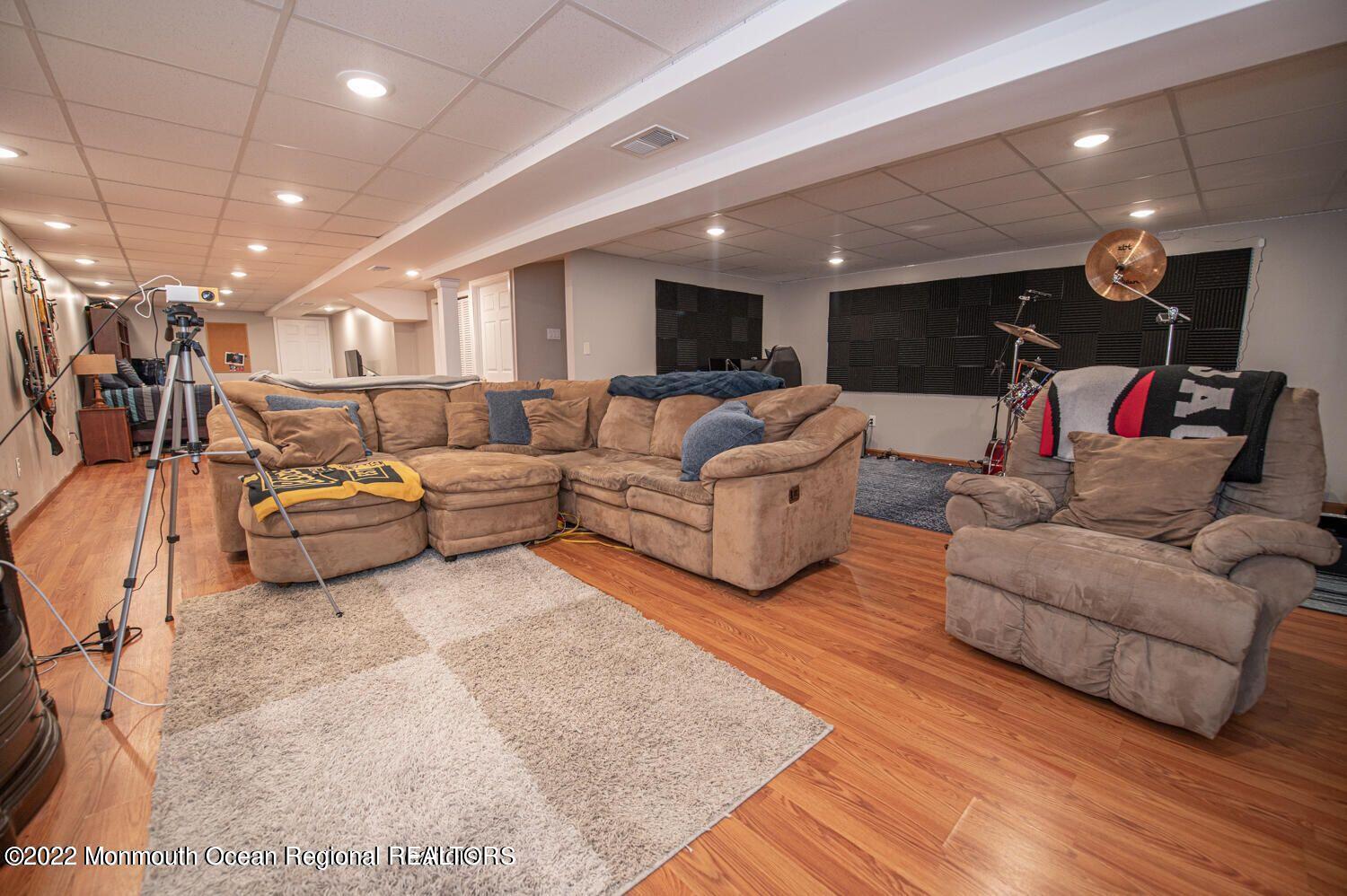 109 Brookfield Drive Jackson, NJ 08527 - Photo 34 of 40 a living room with furniture and a wooden floor