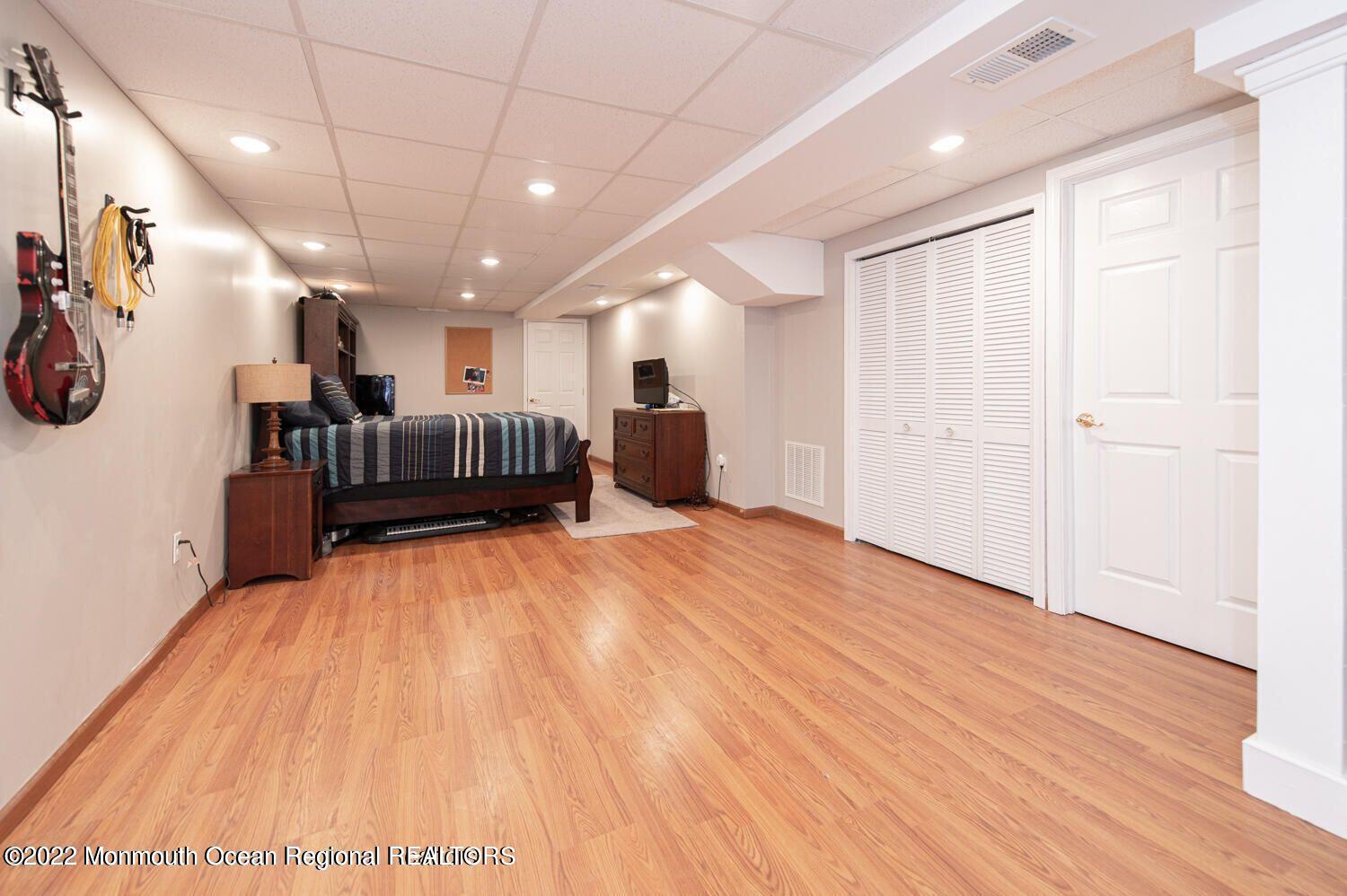109 Brookfield Drive Jackson, NJ 08527 - Photo 35 of 40 a view of a hall with wooden floor