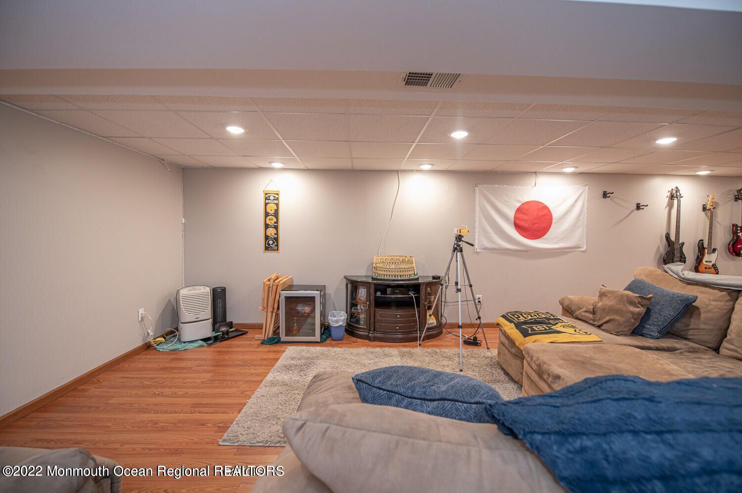 109 Brookfield Drive Jackson, NJ 08527 - Photo 36 of 40 a bedroom with a bed and wooden floor