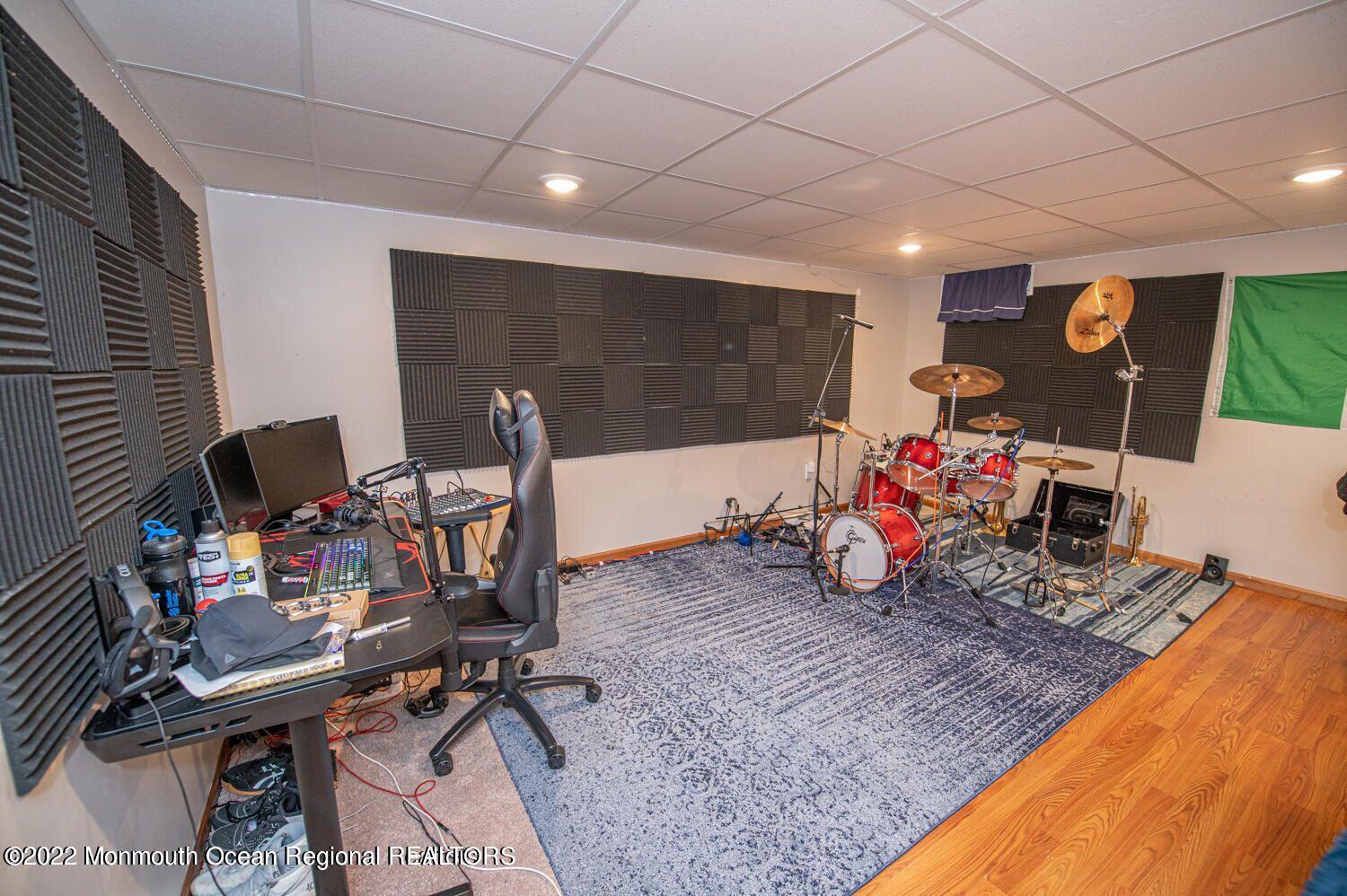 109 Brookfield Drive Jackson, NJ 08527 - Photo 37 of 40 a room with furniture and a wooden floor