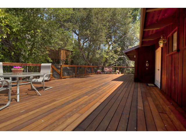175 Ridgeway Road Hillsborough, CA 94010 - Photo 1 of 23 a terrace with outdoor seating and wooden floor
