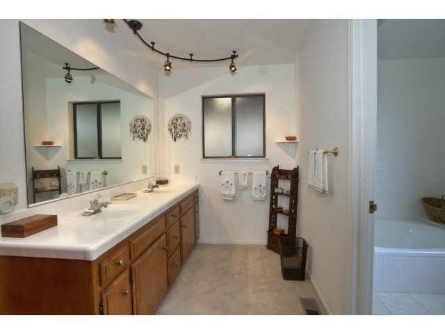 175 Ridgeway Road Hillsborough, CA 94010 - Photo 11 of 23 a bathroom with a sink vanity and mirror